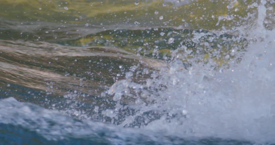 A crashing ocean wave in the daytime