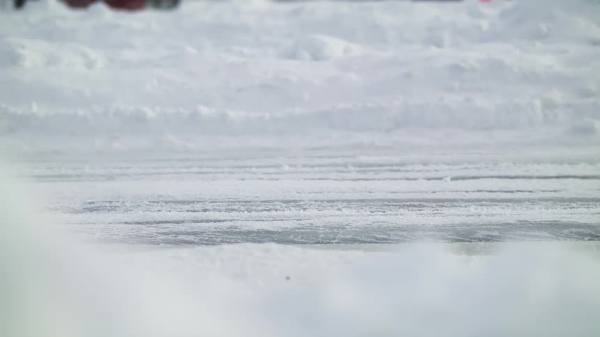 Race car driving over a race track in the snow