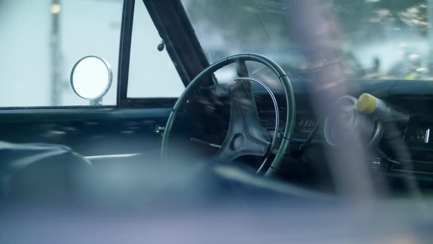 A car is parked outdoors in spring