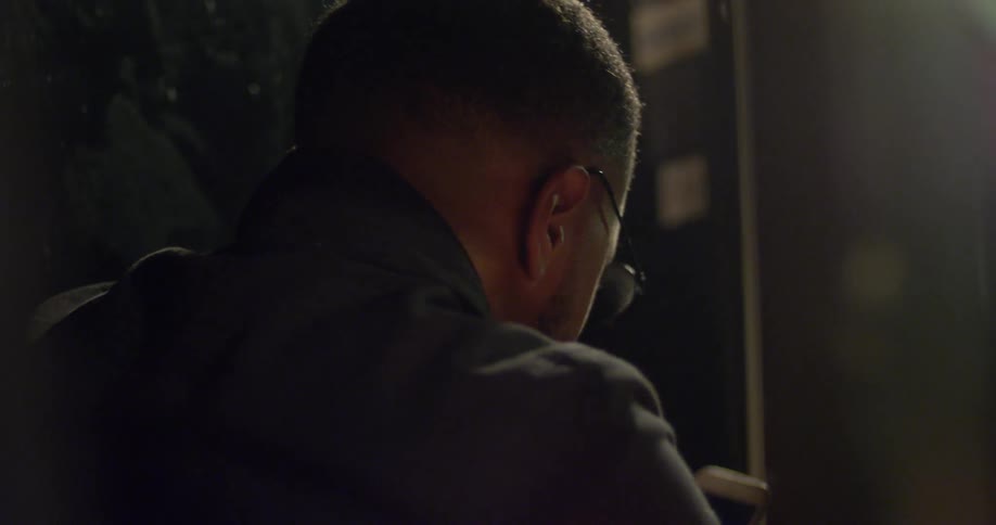 Close up of a man looking at his phone