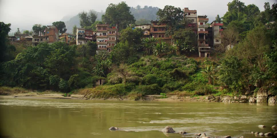 Houses off the shore of a river