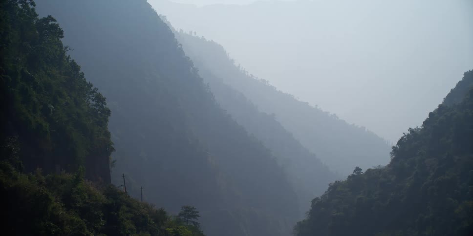 A mountain landscape on a misty day