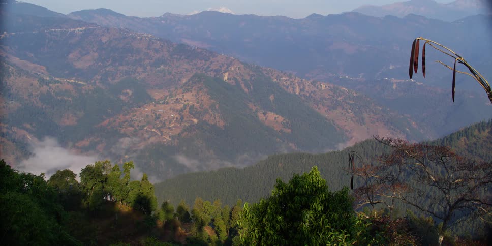 An aerial view of a mountain is displayed