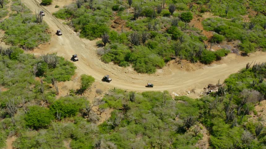 Cars are driving in a rural area