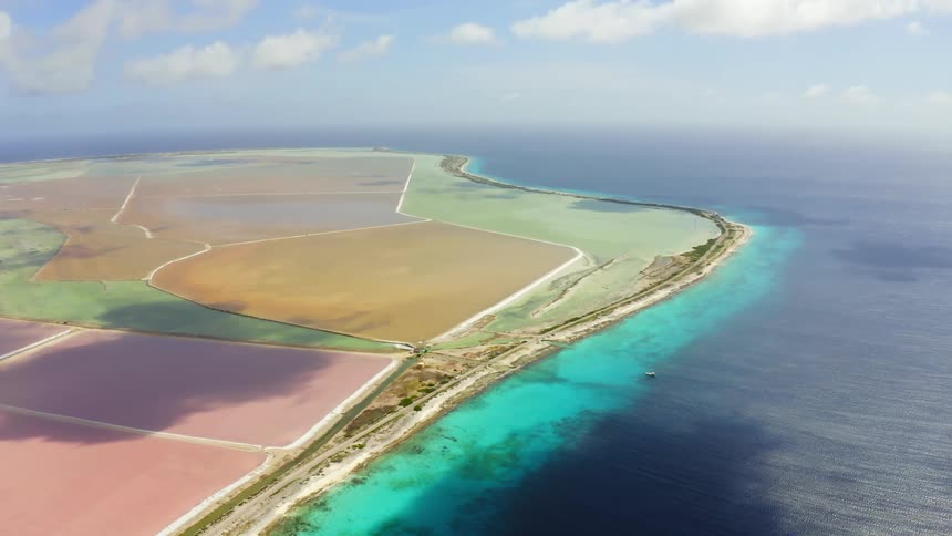 An aerial view of a shoreline in the daytime