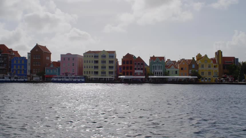 A view of some colorful buildings next to a river