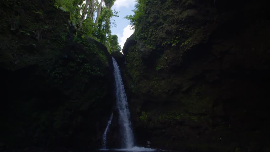 A waterfall crashing in to the water below