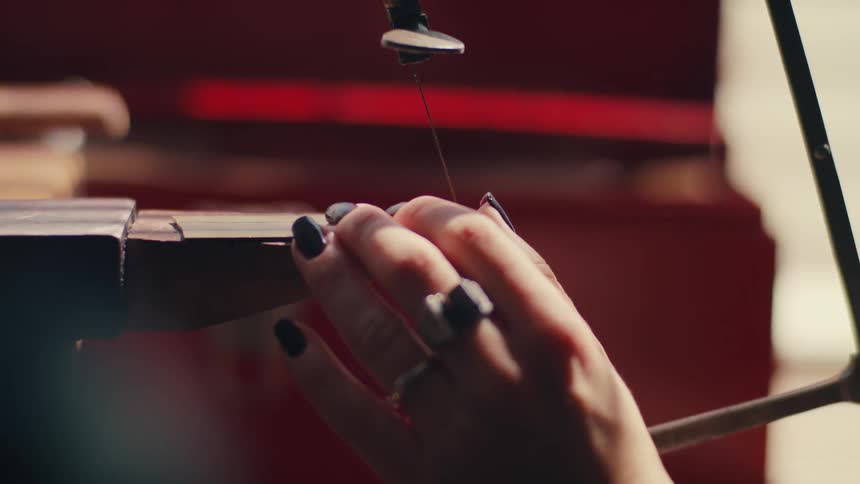 A woman using a hand saw