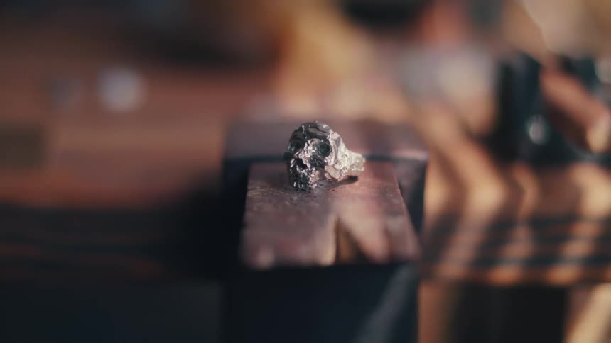 A metallic object sits near a bench