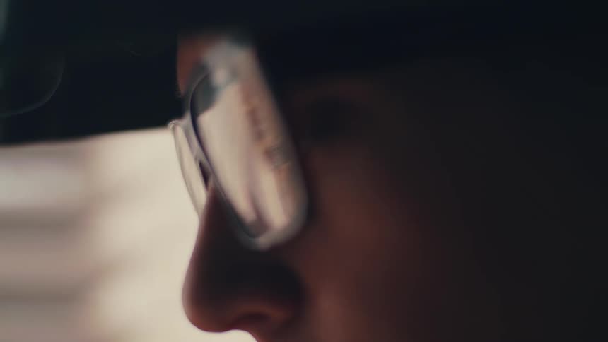 Person removes safety goggles from his face