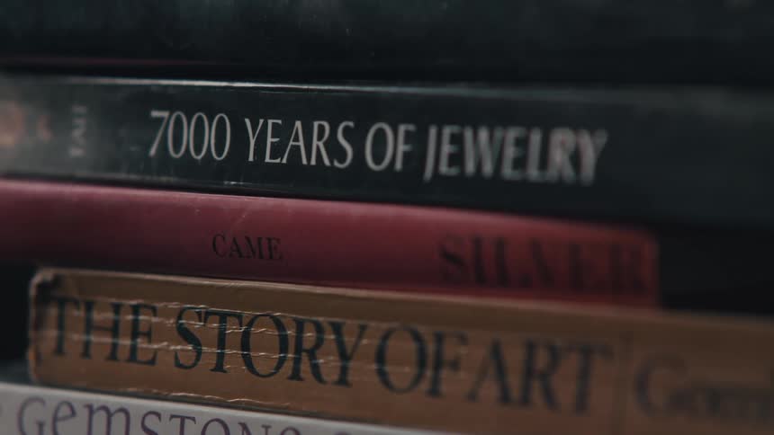 A stack of books with different titles