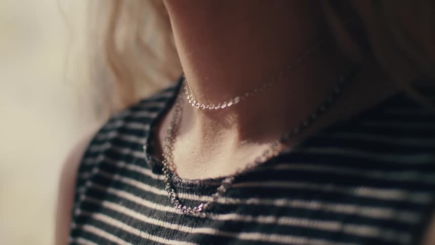 A woman is wearing jewelry