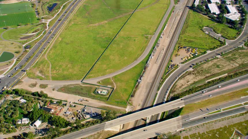 Traffic traveling along the several streets and bridges of a busy freeway