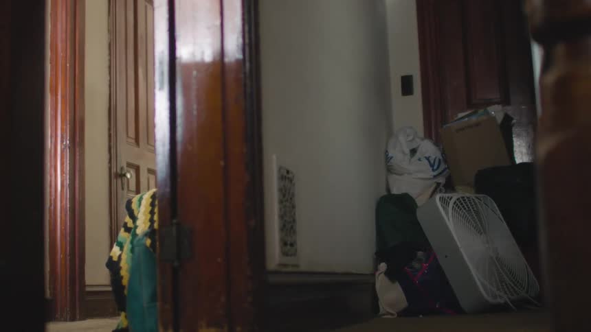 View of some items stacked near a door in a hallway