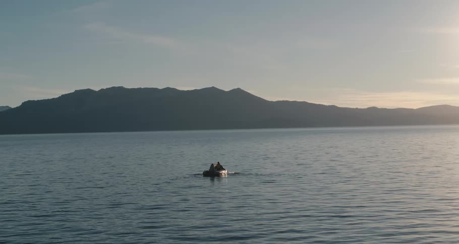 Two people in a boat on a lake