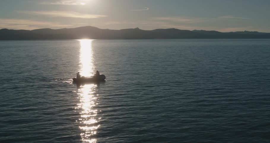 Two people in a rowboat on a lake