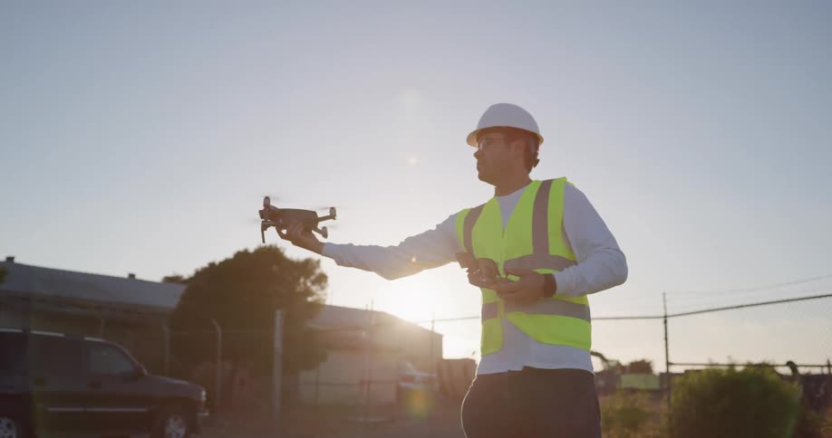 A construction worker brings down a drone he was lying in a parking lot