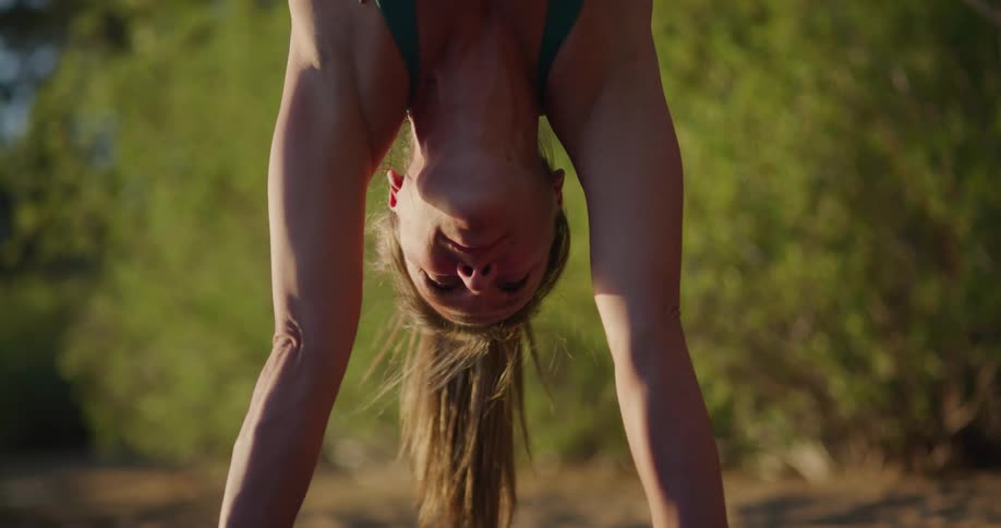 A woman is stretching outdoors in spring