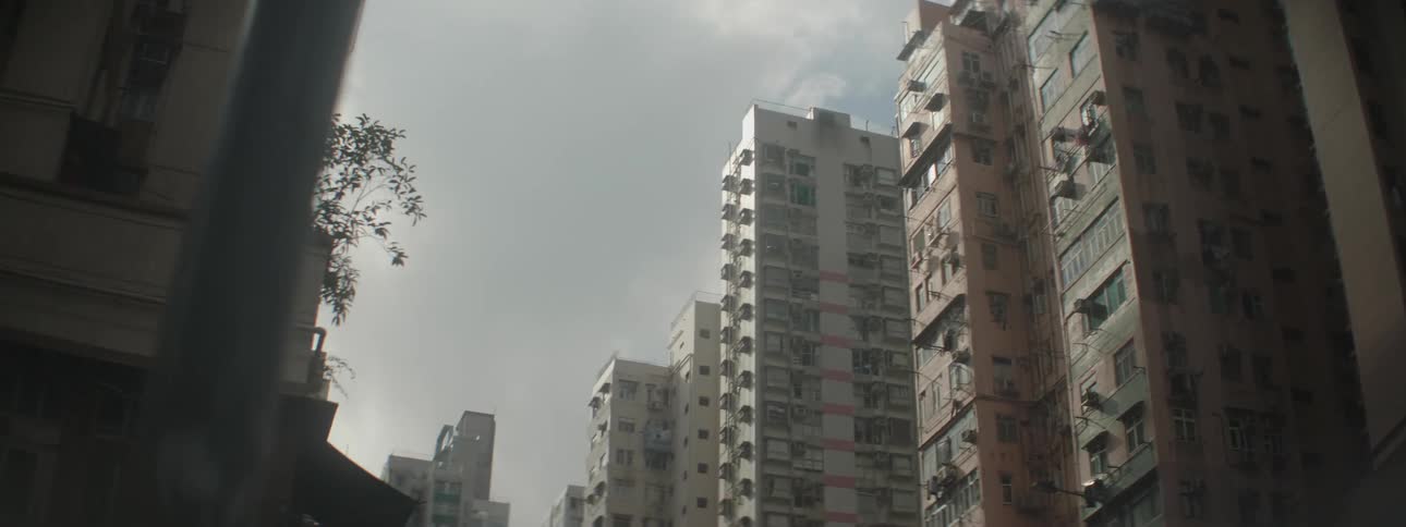 Tall apartment buildings in a city in the daytime