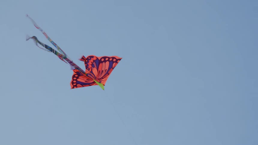 A colorful kite is being flown in the air