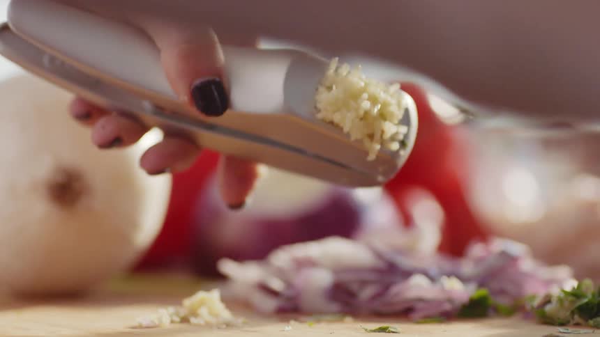 A woman is preparing food in her kitchen