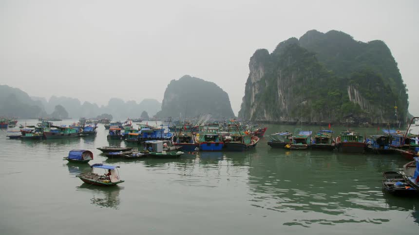 Boats on a river docked near islands
