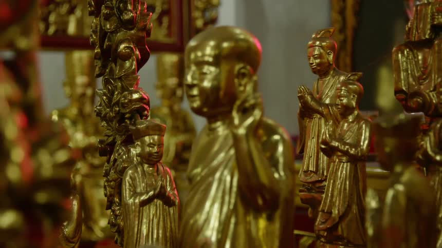 A room full of eastern religious statues and artwork