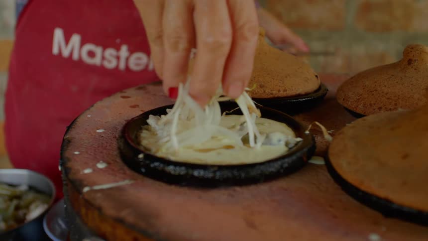 A woman cooking in a restaurant