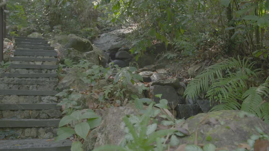 Water pours off on the side of the stone steps