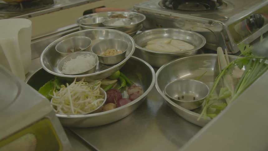 Food next to a cook top ready to be prepared