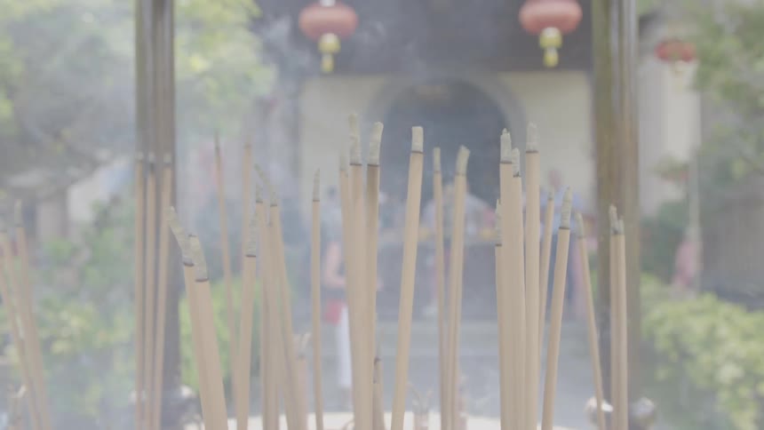 Incense is burning in front of the temple