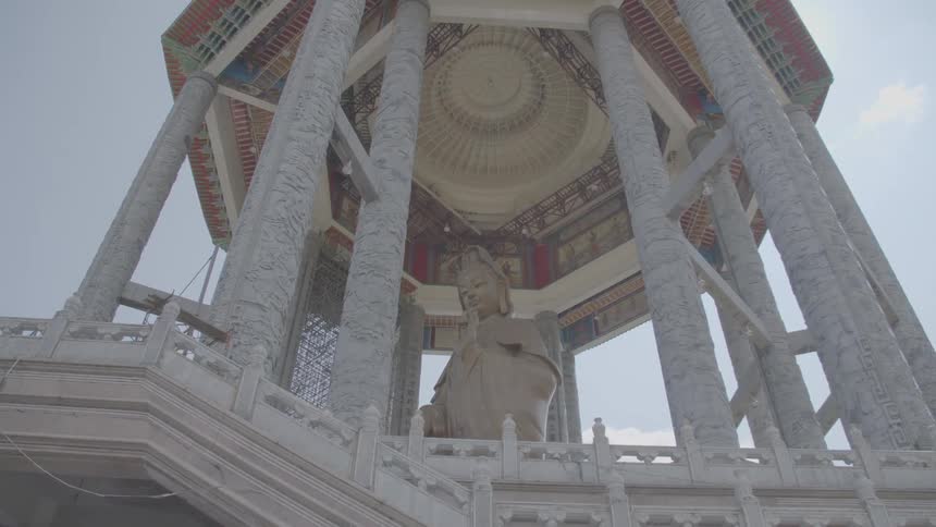 A tower with a statue in the center