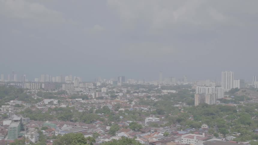An aerial view of a city skyline on a cloudy day