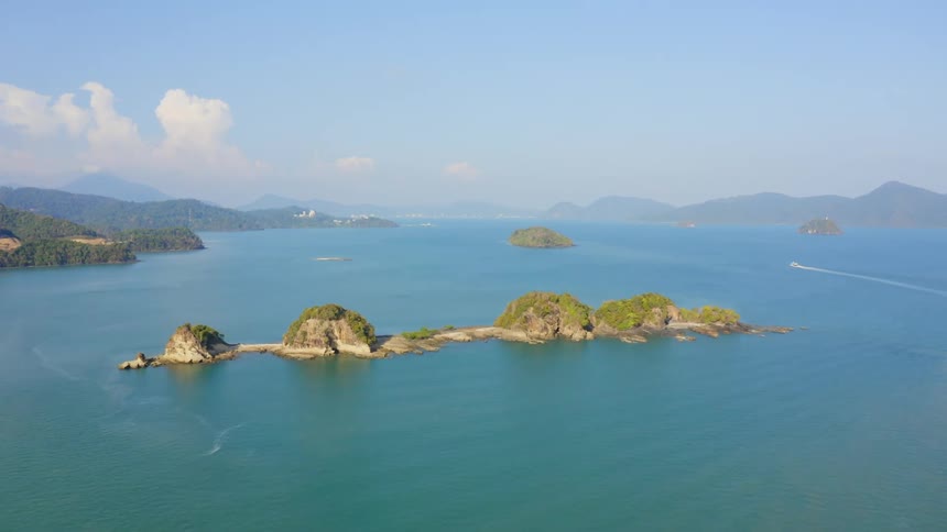Mountains and islands in a large body of water