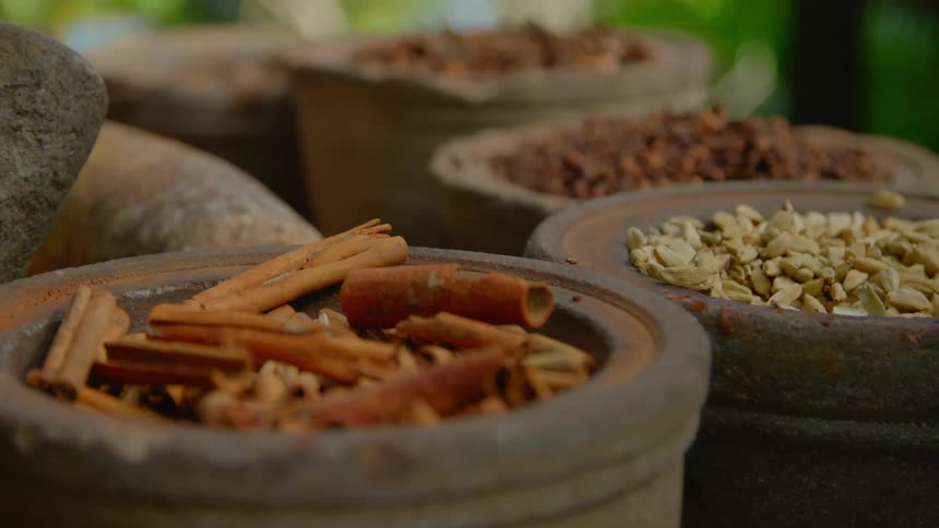 Food and spices in old ceramic bowls on a table