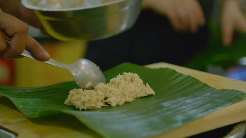 A person preparing food in a kitchen