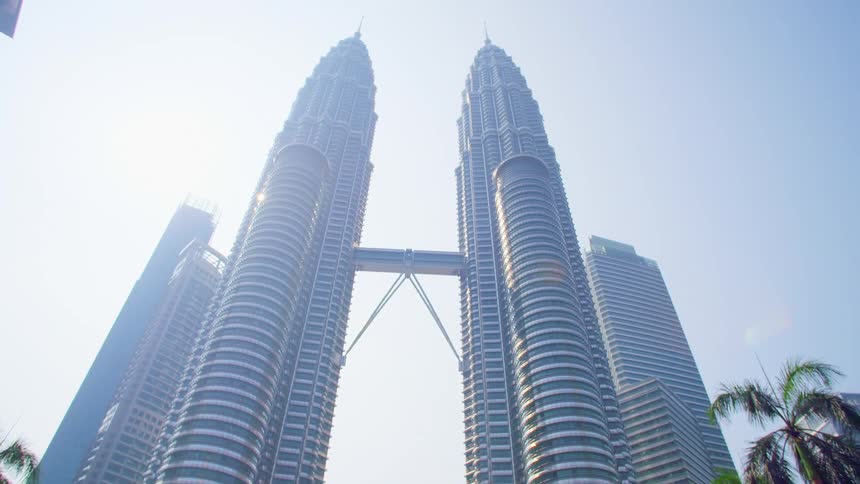 Skyscrapers towering overhead on a sunny summer day