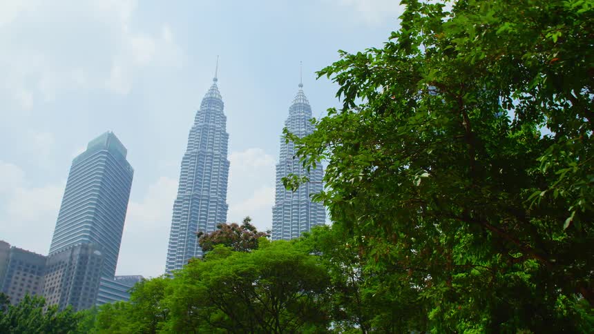 A city skyline is displayed at midday
