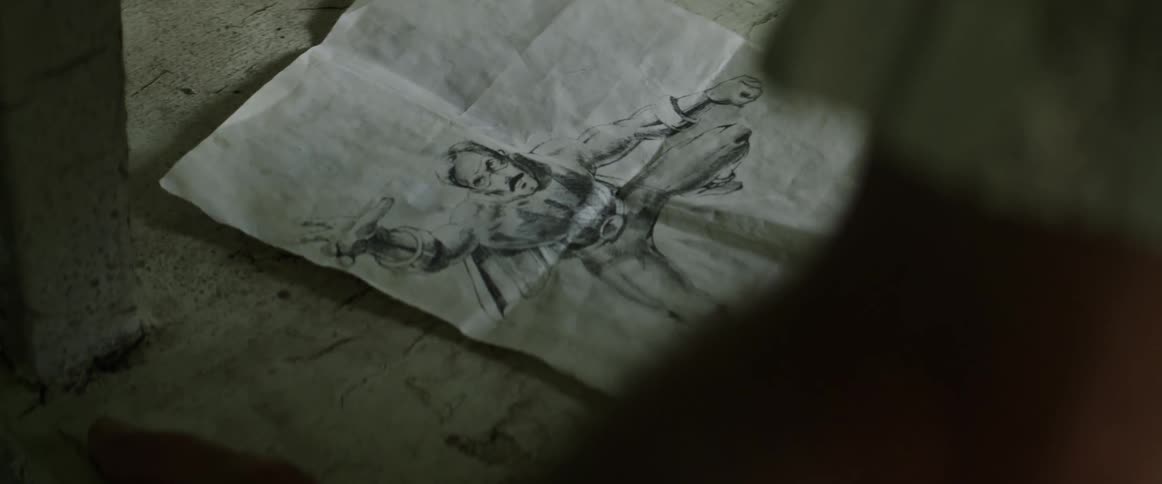 A hand drawn picture is on the ground