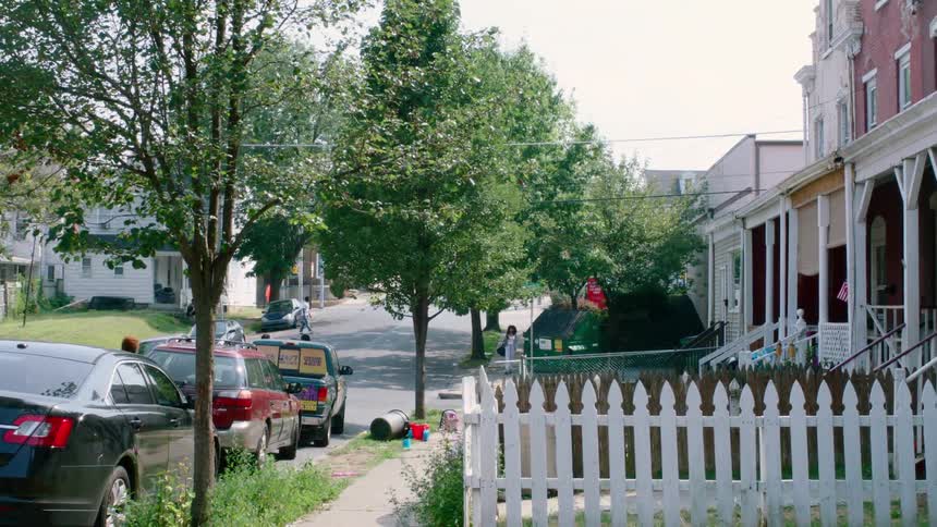 People are walking on a residential street