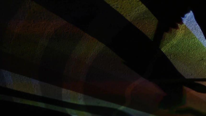 Shadows are shown across a ceiling with flashing lights