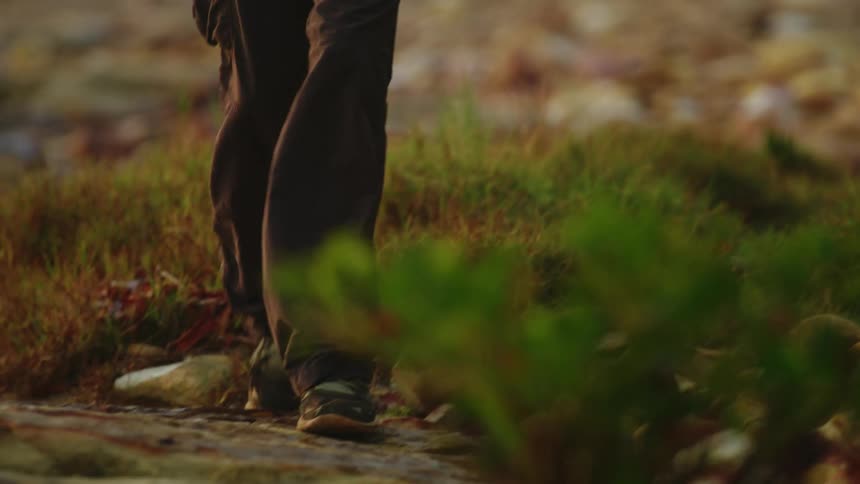 A woman is walking outdoors in spring