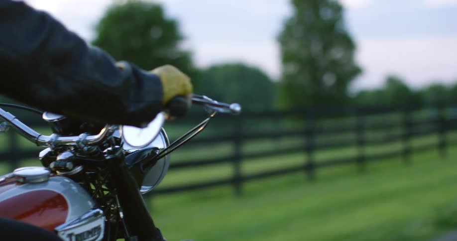 A person is riding their motorcycle down the road