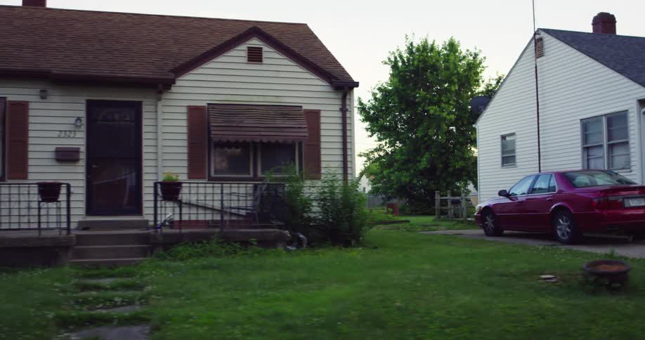 A row of houses in a city neighborhood in the evening
