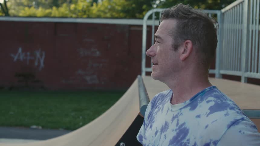 People are riding their skateboards in the park