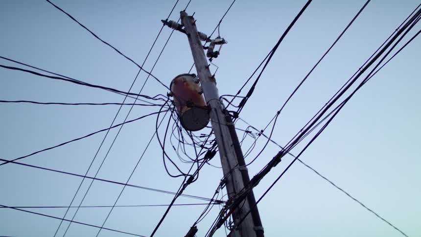 Telephone pole with many wires and transformer