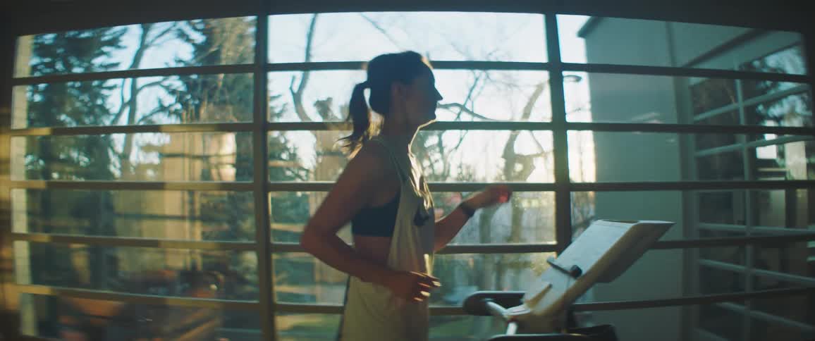 A woman is working out indoors during spring