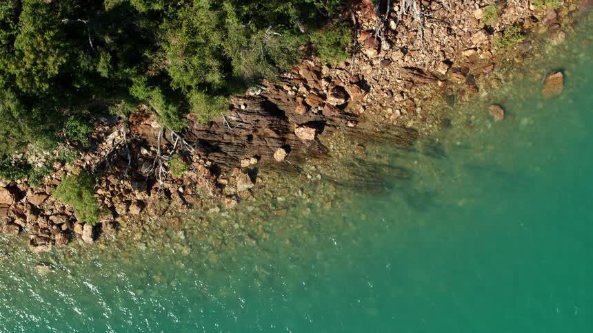 An aerial view of the water on the shore