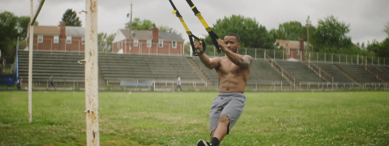 A man is exercising on the field