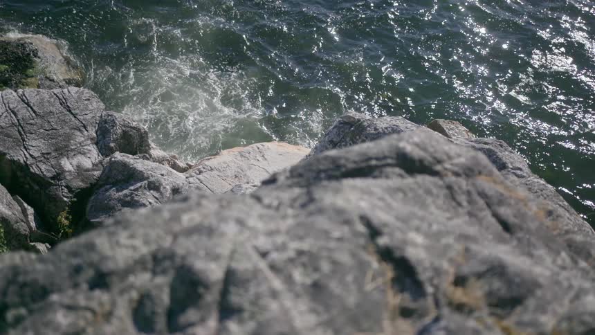 Cliff overlooking water and rocks